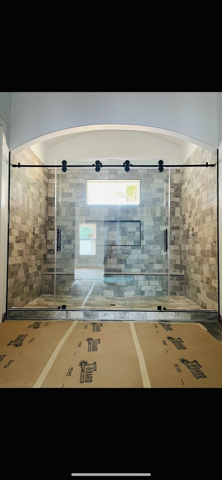 Barn-door slider · arched alcove
